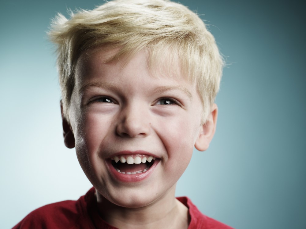 Boy smiling after receiving dental sealants