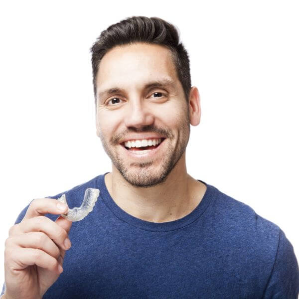 A male patient with Invisalign® aligners